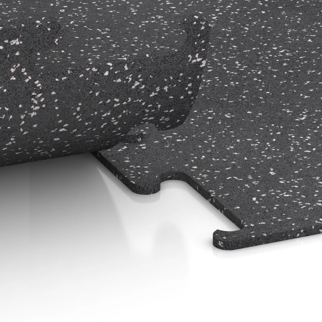 Großaufnahme vom Verbindungssystem von WARCO-Boden 3779 - Pavimento Fitness Performance Elite im Farbdesign Gris ligeramente moteado. Abmessungen 50 x 50 x 1 cm | 0,25 m².