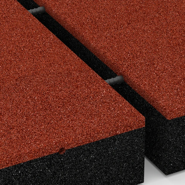 Großaufnahme vom Verbindungssystem von WARCO-Boden 6278 - Baldosa amortiguadora – 300 cm im Farbdesign Rojo ladrillo. Abmessungen 50 x 50 x 11 cm.