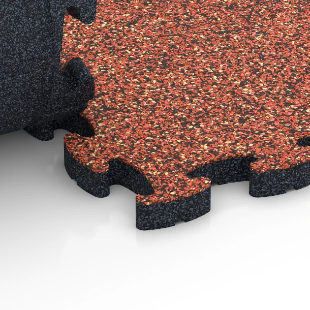 Großaufnahme vom Verbindungssystem von WARCO-Boden 6935 - Loseta amortiguadora puzzle im Farbdesign Etna. Abmessungen 44,6 x 44,6 × 2,8 cm.