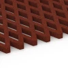 Großaufnahme vom Verbindungssystem von WARCO-Boden 7010 - Rejilla amortiguadora césped im Farbdesign Rojo ladrillo. Abmessungen 100 x 100 x 4 cm.